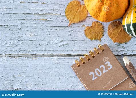 Autumn Leaves And Pumpkin With Spiral Calendar 2023 Year On Rustic