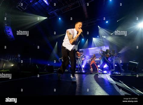 Macklemore in concert Stock Photo - Alamy