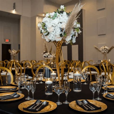 Lavish Tablescape With Tablecloths Flowers Flower Stands Pampas Sprays Chargers And Tall