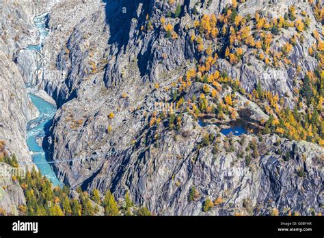 Aerial View Of The Suspension Bridge Over The Canyon Below Aletsch