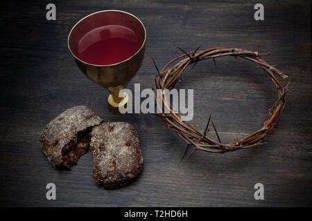 Communion Unleavened Bread With Chalice Of Wine And Cross Light Stock