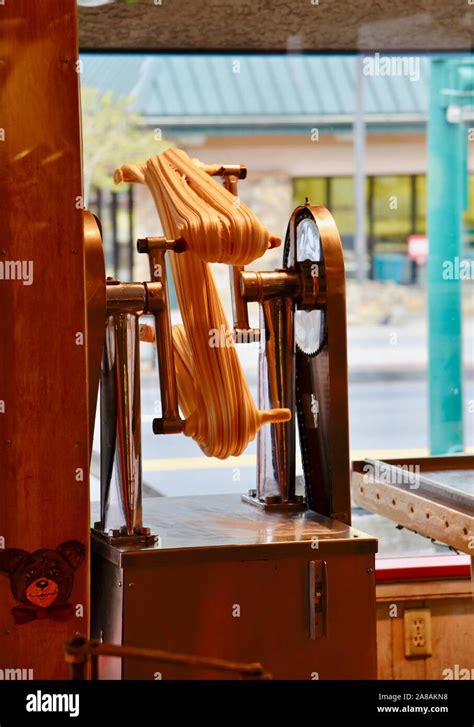 Taffy pulling machines hi-res stock photography and images - Alamy