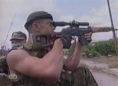 Russian Military Personnel Mounted On An Apc Use An Svd Marksman Rifle