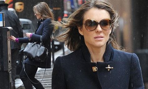 Elizabeth Hurley Hides Behind Sunglasses In The Rain After Her Glamorous Royal Night Out Daily