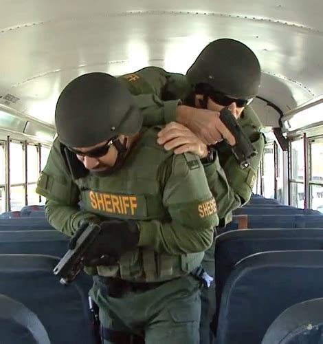 Swat Team Conducts School Bus Hostage Training