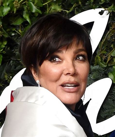 Kris Jenner Layered Black Pixie Haircut With Light Brunette Highlights