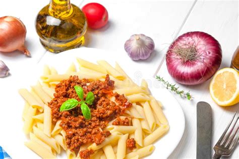 Spaghetti Pasta Bolognese With Ingredients On White Wooden Background