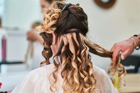 Woman Curling Her Hair · Free Stock Photo