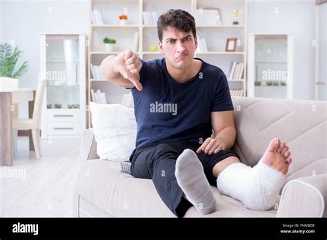 Man With Broken Leg Recovering At Home Stock Photo Alamy