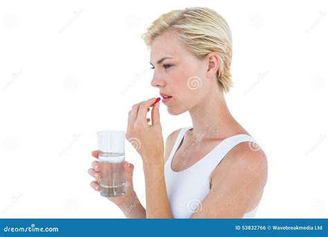 Pretty Blonde Woman Holding Glass Of Water And Ready To Swallow Red Pill Stock Photo Image Of