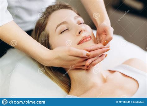 Facial Massage Beauty Treatment Close Up Of A Young Woman S Face Lying