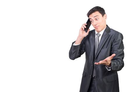 Premium Photo Confused Man In Suit Talking On Smartphone