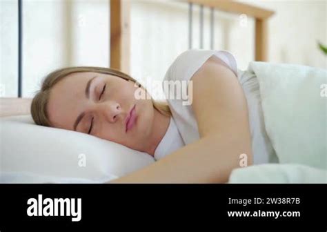 Woman Waking Up In Her Bed Fully Rested Woman Stretching In Bed After