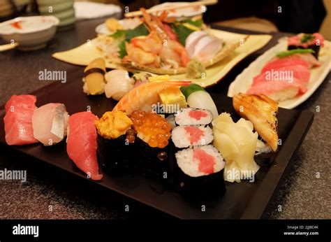 Close Up Assorted Sushi Rolls And Sashimi Salmon Tuna Shrimp Eel