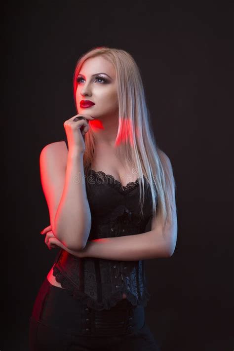 Seductive Blonde Lady In A Corset With Red And Blue Light Stock Photo Image Of Caucasian Slim