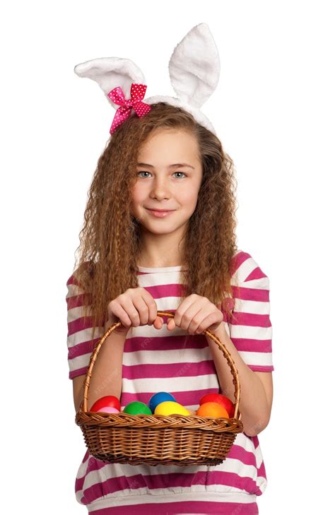 Premium Photo Happy Girl With Bunny Ears Holding Basket Of Eggs