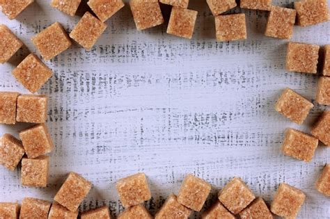 Premium Photo Brown Sugar On Wooden Background