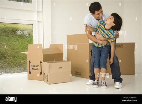 Mature Man Playing With His Son And Smiling Stock Photo Alamy