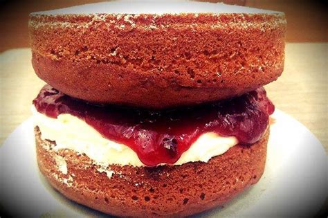 A Close Up Of A Doughnut On A Plate With Icing And Toppings