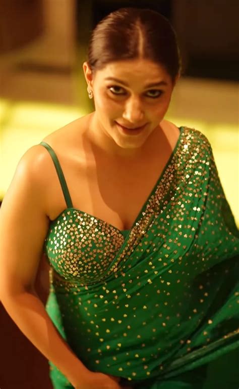 Sapna Choudhary Sizzles In Hot Green Blouse And Matching Saree Pics