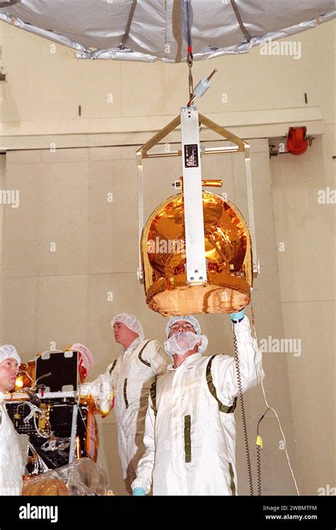 Technicians Guide The Gamma Ray Spectrometer Grs Into Place To Be