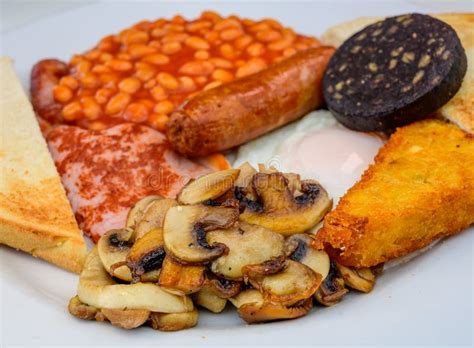 White Board With Full English Breakfast With Bacon Fried Egg Beans