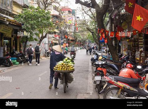 Hanoi Street Vendor A Street Scene In The Old Quarter In Hanoi Fruit Street Vendor Pushing