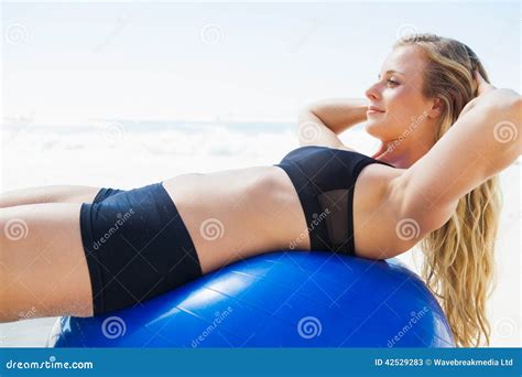 Fit Blonde Doing Sit Ups On Exercise Ball At The Beach Stock Image Image Of Female Side