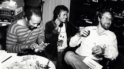 Black And White Photograph Of Three Men Sitting At A Table Eating Cake