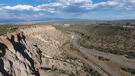 Aerial Drone Footage Of New Mexico Canyons Along A Winding Highway Valley 2