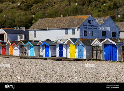 Colourful Beach Huts In Front Of The Boat Building Academy And