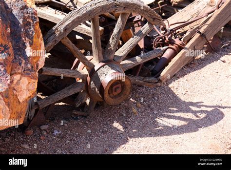 Old broken wagon wheel at rest Stock Photo - Alamy