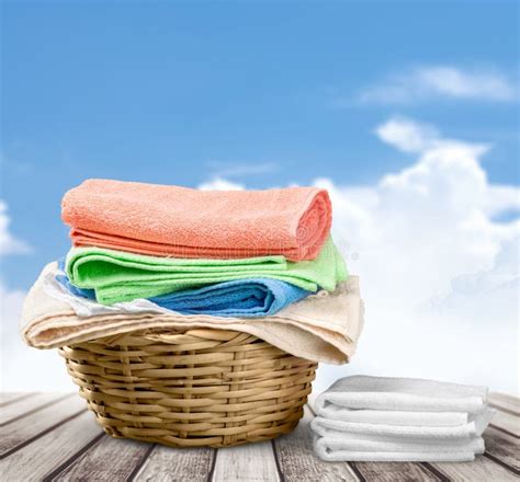 Laundry Basket With Colorful Towels On Background Stock Photo Image