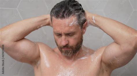 Middle Aged Man Washing Hair In Bath Guy Bathing Shower Head In