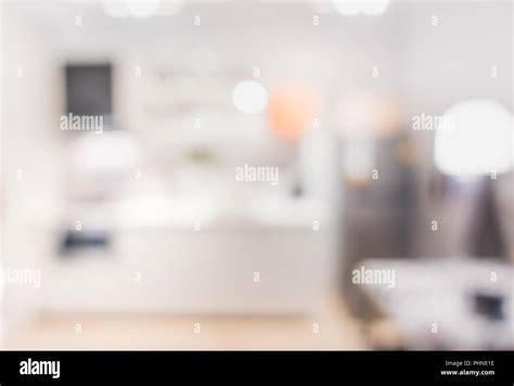 Blurred Background Modern Kitchen And Dinning Room In House With Bokeh