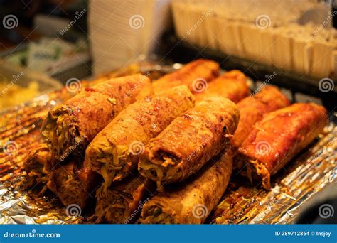 Grilling Barbecue Meatloaf Rolled With Vegetables At Traditional Night