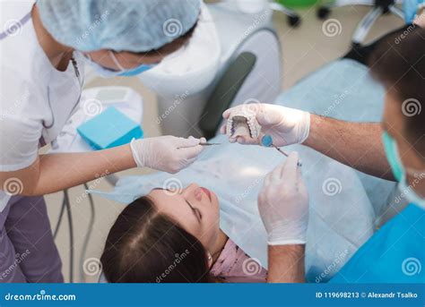 Doctor Orthodontist Explains To The Patient How He Will Treat Her Stock