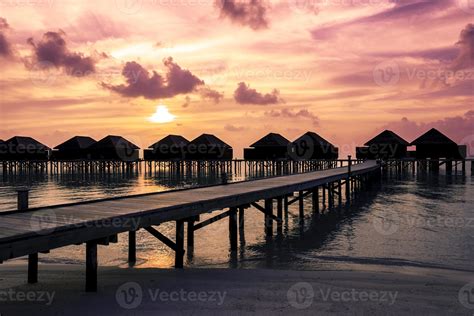 Maldives sunset with water villas silhouette 1183517 Stock Photo at ...