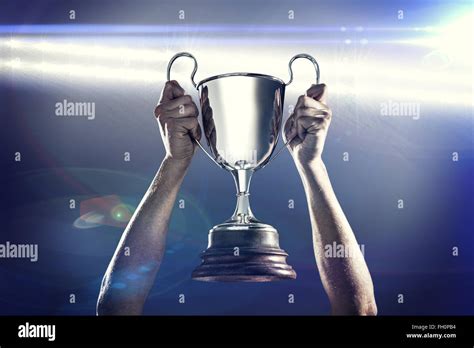 Composite Image Of Successful Rugby Player Holding Trophy Stock Photo