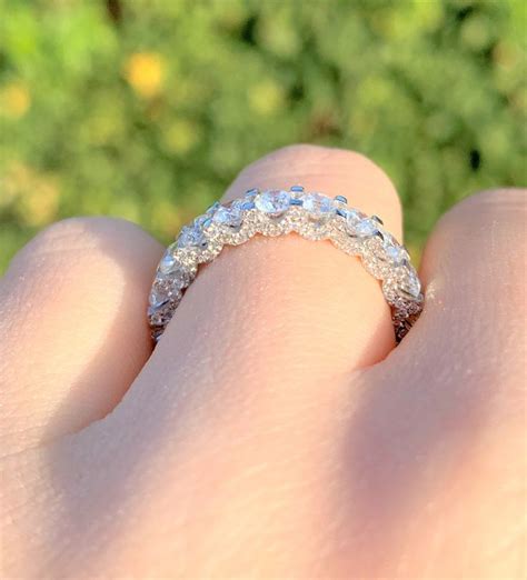 A Close Up Of A Person S Hand With A Wedding Ring On Their Finger