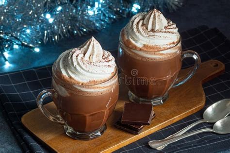 Hot Chocolate Topped With Whipped Cream And Cocoa With Holiday