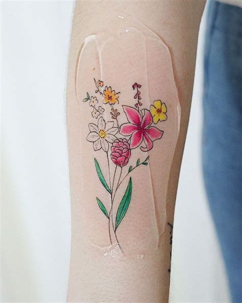 A Woman S Arm With Flowers Painted On It