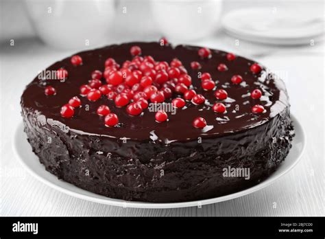 Chocolate Cake With Cranberries On Plate Closeup Stock Photo Alamy