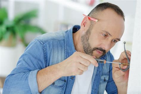 Man Installing Hook On Wall Stock Image Image Of Coathanger Metallic