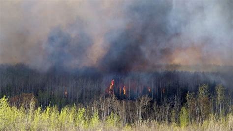 Massive Alberta Wildfire Spreads South Forcing More Evacuations Bbc News