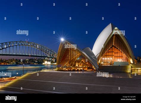 Panoramic View Of The Sydney Opera House And Harbour Bridge At Night