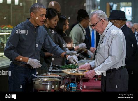 Us President Barack Obama And First Lady Michelle Obama Serve