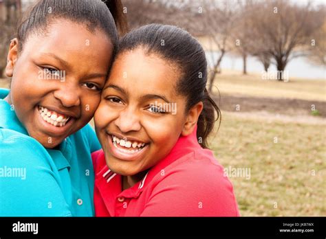 Happy African American Father And Son Talking And Laughing Stock Photo