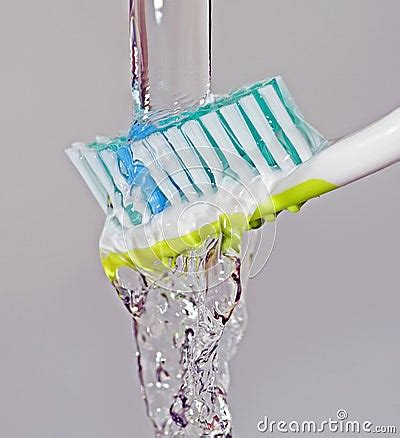 Toothbrush Under Running Water Stock Photography - Image: 22290842