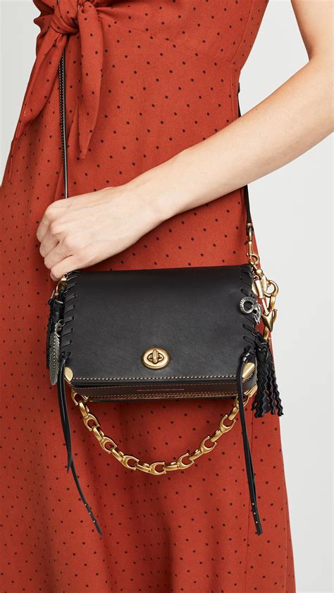 Coach Dinky 19 Crossbody Bag With Charms And Leather Strap In Black Lyst